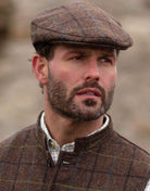 Abraham Moon Tweed Alfred Flat Cap in Oak Brown, on model