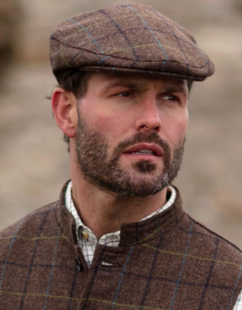 Abraham Moon Tweed Alfred Flat Cap in Oak Brown, on model